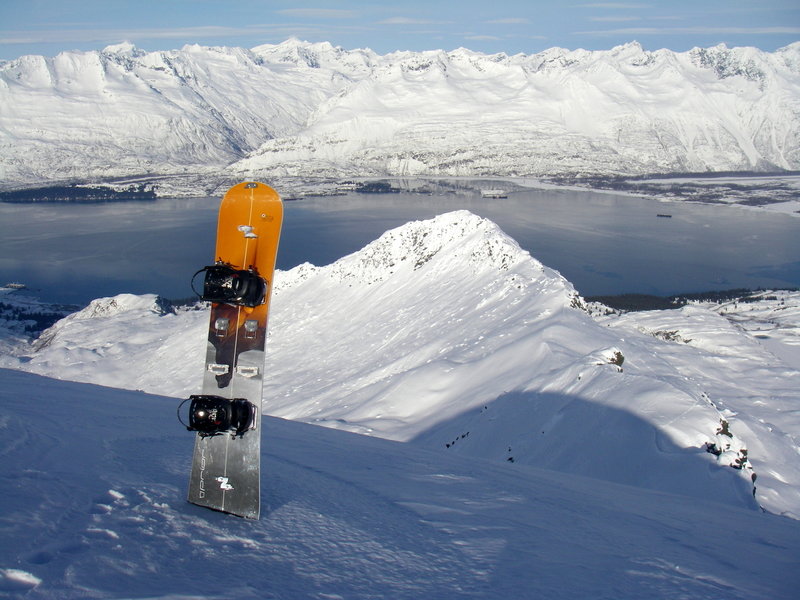 The split board makes another sunny day even more amazing on the summit of Snowdome with Valdez in the back ground.
