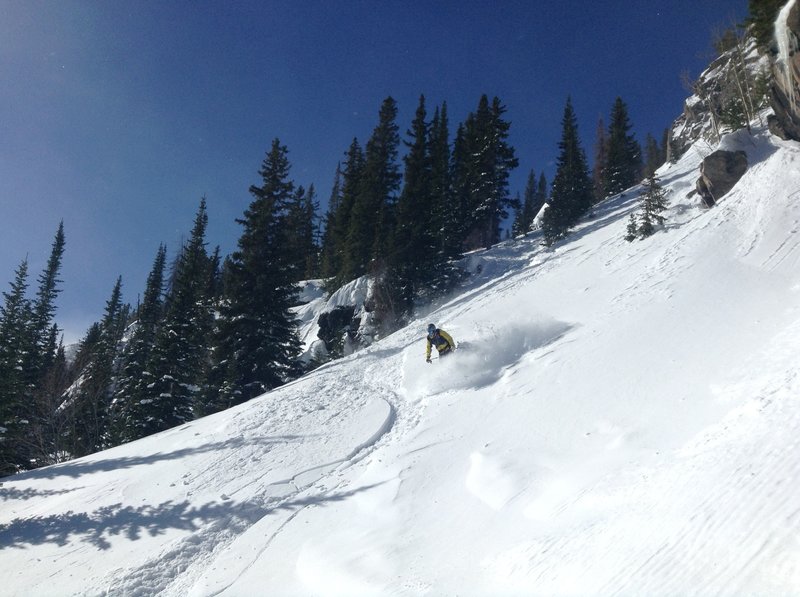 Nick finding the good stuff near the bottom of the terrain park. See that cliff to his (skier's) left? Stick close to it.