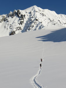 Headed up The Steg toward Peak 8100. The prominent coulior at the shadow line is SXSW.