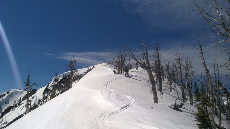 At just about the top of the ridge, the top of Impatient is visible.