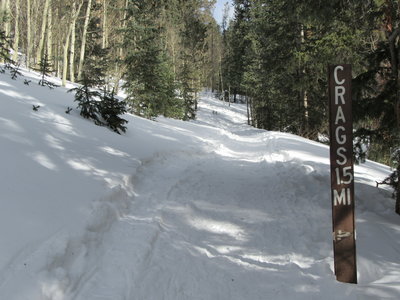 This trail junction is shortly after you pass through the Crags Campground. Bear left to head up the Crags Trail, bear right to head up the Devils Playground Trail.