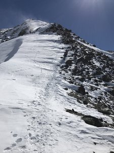 Once you get above the scree, another obvious staircase takes you up to the entrance to the Y Chutes. Cut right about 3/4 of the way up the photo where the tongue of snow makes it most of the way across the rocks.