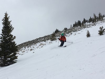 A rocky screen constrains the windy upper section.