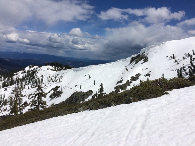Looking SE at the north facing slope above Heart Lake with it's avy debris, and cornices. May 2017.