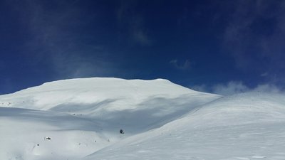 Mount Teghenis rises above the skin track.