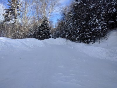 At the end of Ravine Road is a turnaround, which may have been plowed before the lodge closed. The Al Merrill Trail is straight ahead.