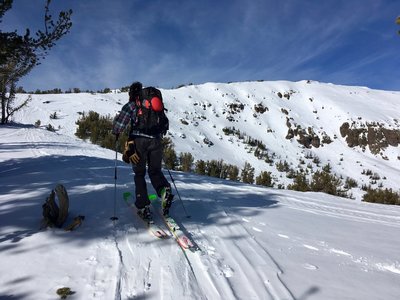 View of the Relay Peak Face descent line from the corresponding ridgeline.