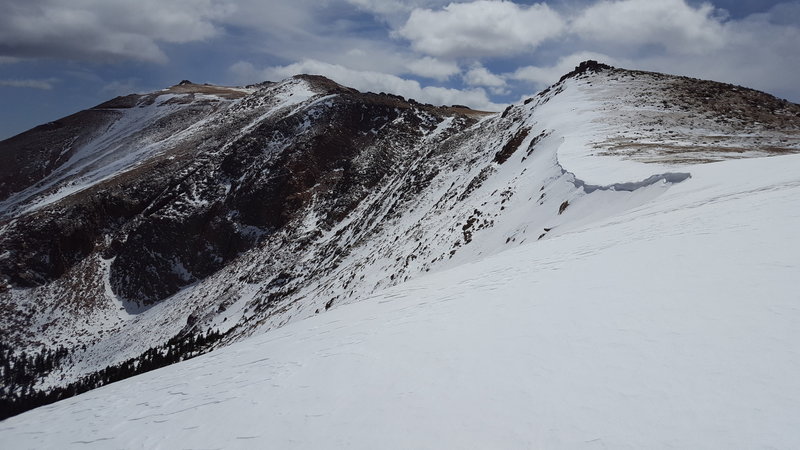 North side of the ridge above cornice bowl, facing south. Easiest descent is downhill from this location, and steeper descents can be found as you approach the cornice
