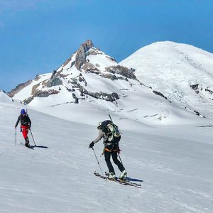 Skinning up towards Little Tahoma with Mt. Rainier looming large.