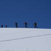 Skiers on the peak of Tsaghkunyats sierra