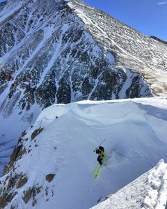 Dropping into Grizzly Couloir after traversing under the cornice.