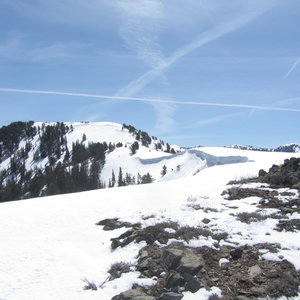 Skin away from the dirt/rocks, yes, but don't skin too close to the edge of the cornice line!