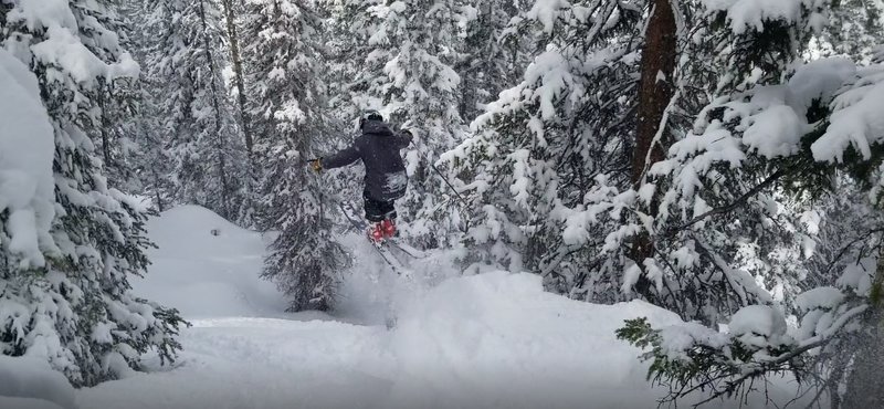 Garrett Gillest sking the Zero Creek pillow line near the bottom of "Morning Glory"