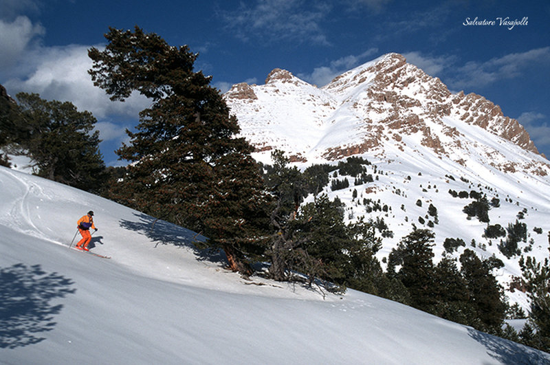 Dan Jones skis spring snow below Sphinx Mountain.