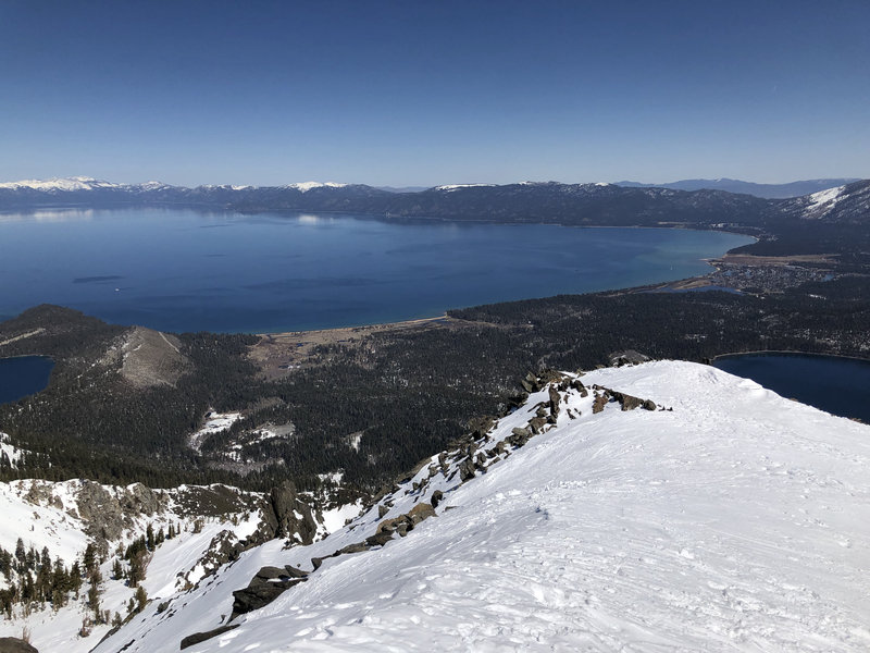 View from Tallac summit facing South Lake Tahoe. Photo taken during early Spring conditions (end of March, 2021).