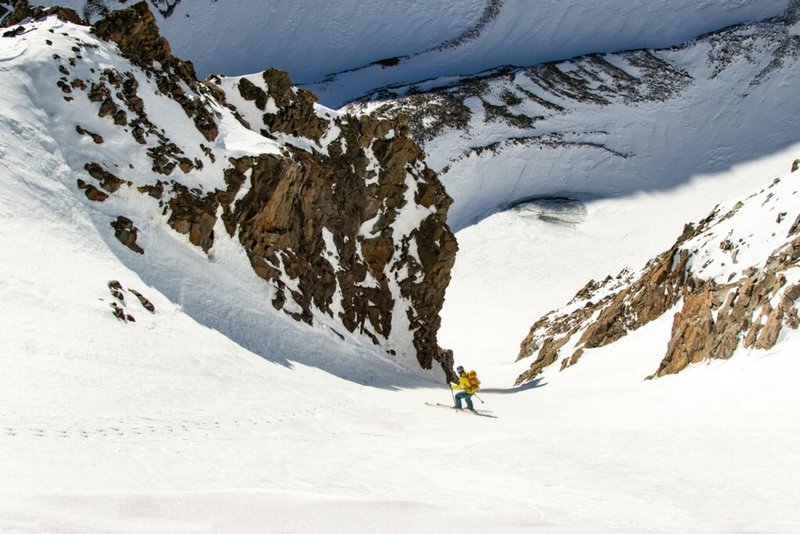 Skiing down Conundrum Couloir in hard conditions.