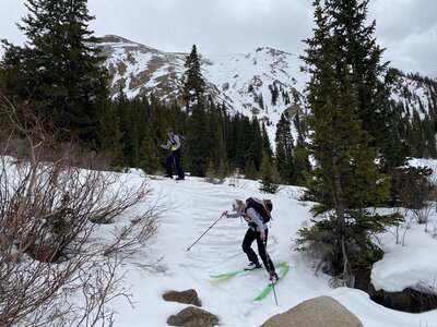 Crossing the creek after the descent is tricky business.