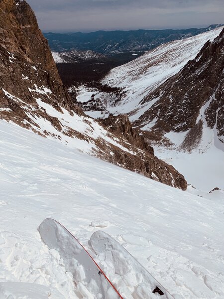 Looking down skis about halfway down the couloir.