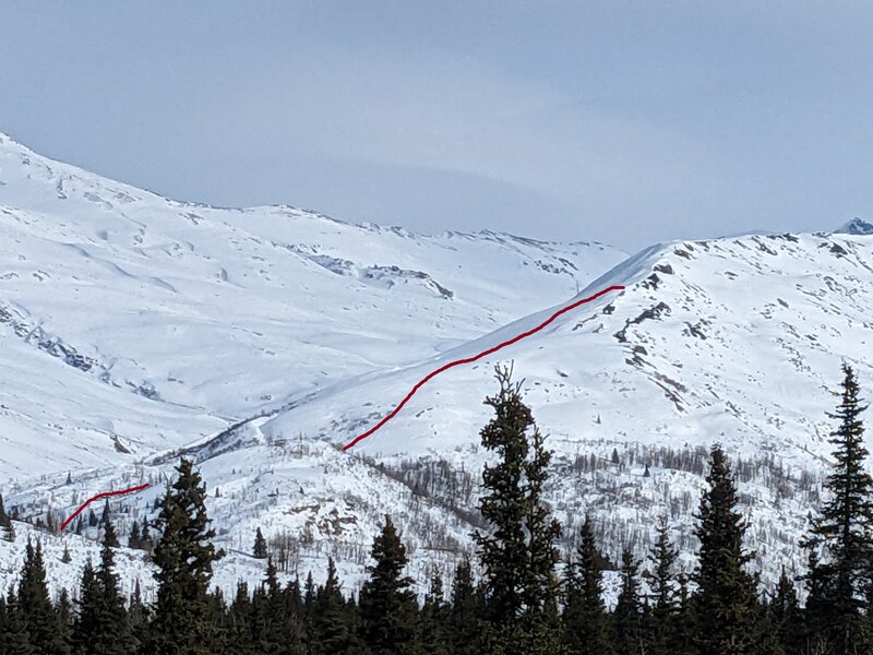 View of the *Ptarmigan Noises* decent, highlighted in red. Decent dips slightly behind the hill in the foreground.