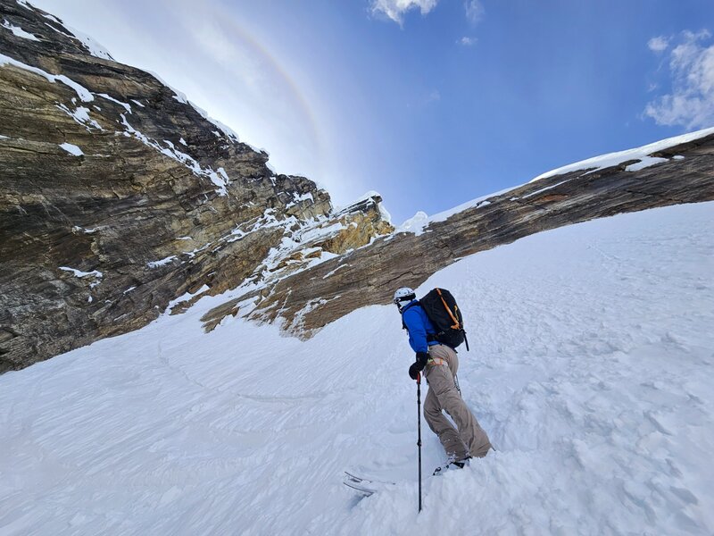 Looking back towards the crux. Slope is 60 degrees through this narrow choke on the skier's right, against the rock wall. This can be downclimbed or rappelled using an anchor on the right wall.