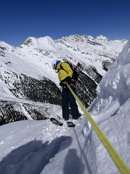 Rapping over the cornice into the STS couloir, Mt Cheops north face.