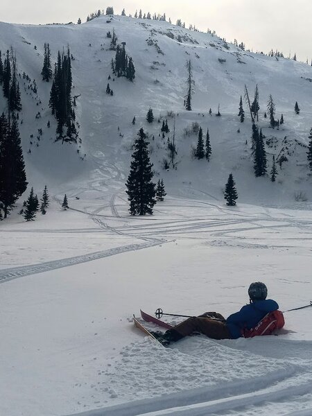 Skiers at the top and bottom of Carbonite Couloir.