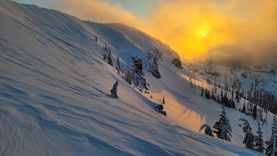 Sunset over Brian Head. Closest area is Brent's Big Bowl, with the Tabs right behind (middle-ish of photo).