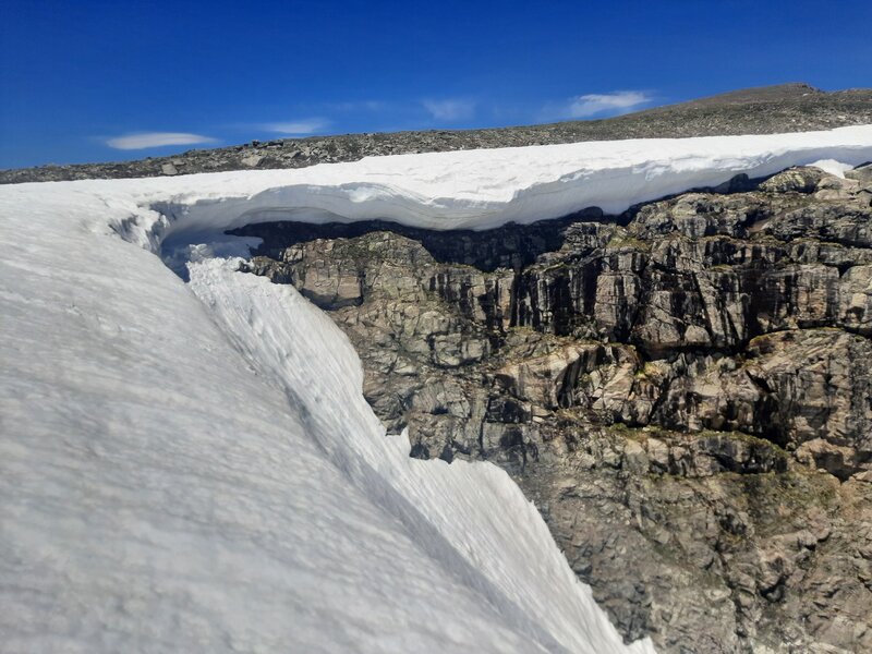 Cornice atop Strait of Gibraltar, looking towards climber's right (taken June 19th, 2026 in record low snow year)