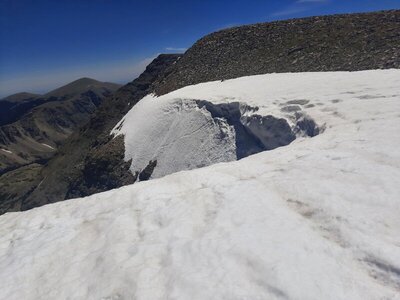 Cornice atop Strait of Gibraltar, looking towards center & climber's left (taken June 19th, 2026 in record low snow year)